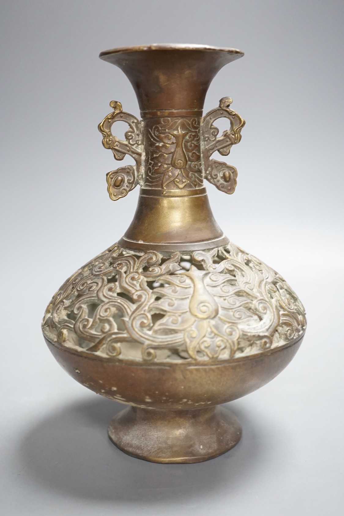 A Chinese pierced brass vase - 20cm tall